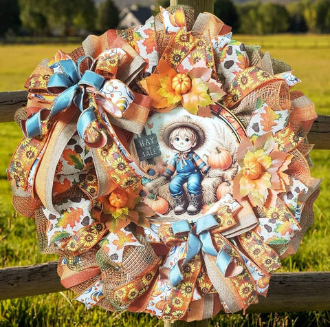 Little Boy Scarecrow with Pumpkins and Sunflowers